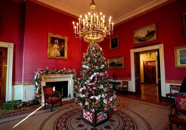 a smaller christmas tree is on display in the red room its decorated with sweets 1512361762 927 width600height421